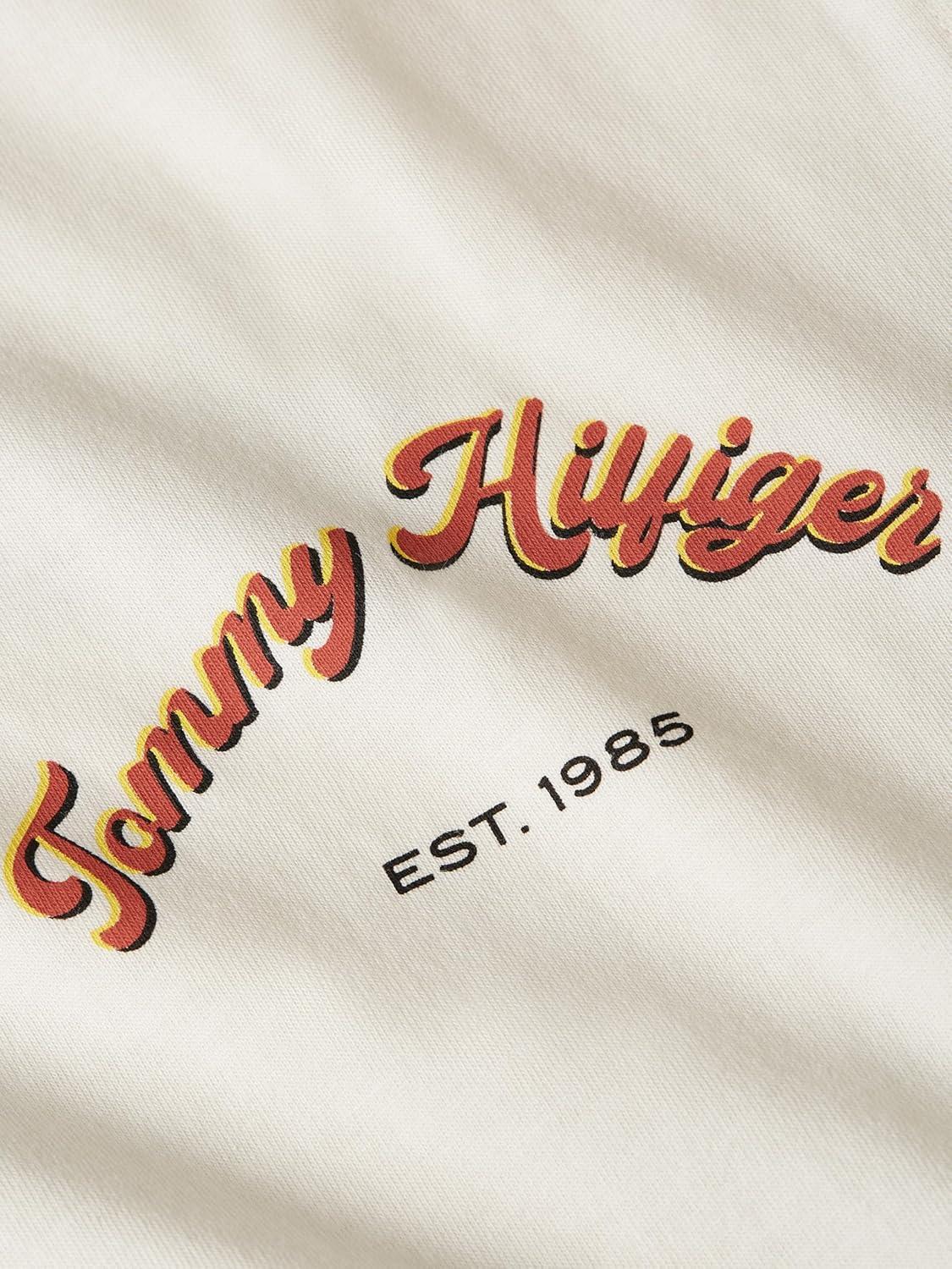 imageTommy Hilfiger Mens Short Sleeve Cotton Graphic TShirts with Printed Arched Back GraphicIvory Petal