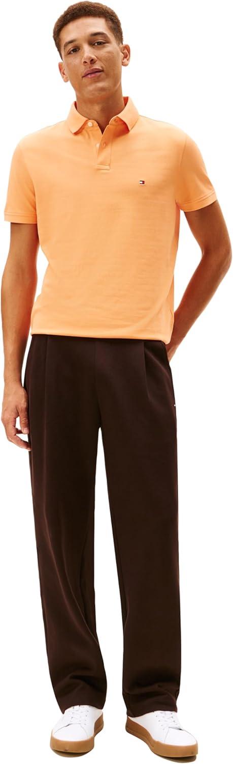 imageTommy Hilfiger Mens Short Sleeve Polo Shirts in Regular Fit with Stretch and Organic Pique CottonFruity Orange